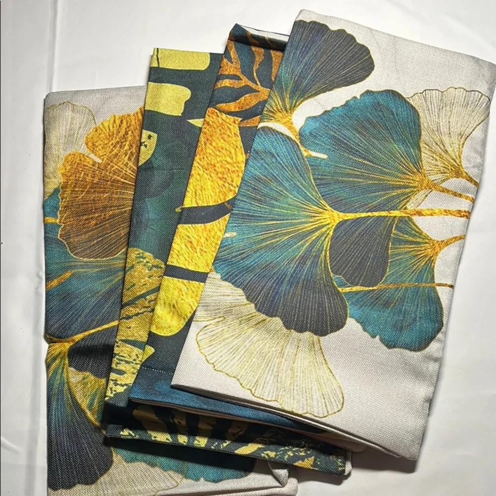 Floral Patterned outdoor waterproof throw pillow with Blue and Yellow Leaves.